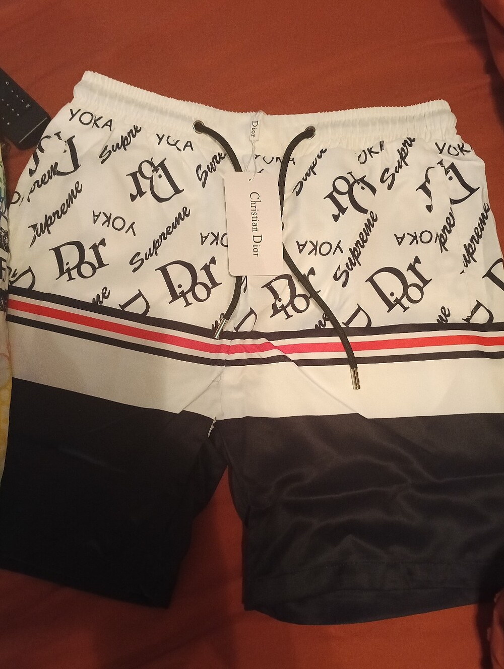 Dior Men’s White Shorts with Black Logo and Red Stripe